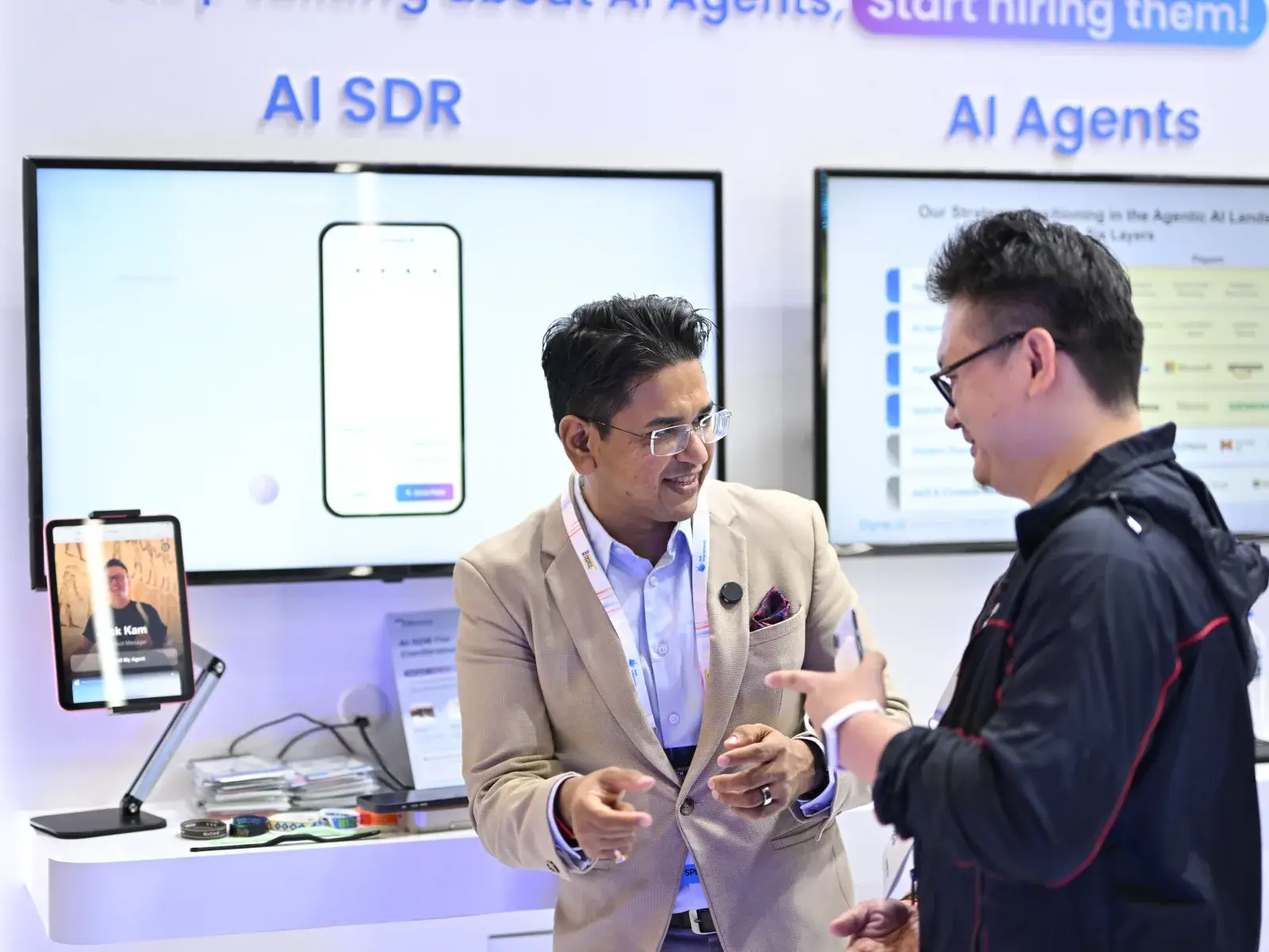 Nucleus team discussing AI agents at an industry event